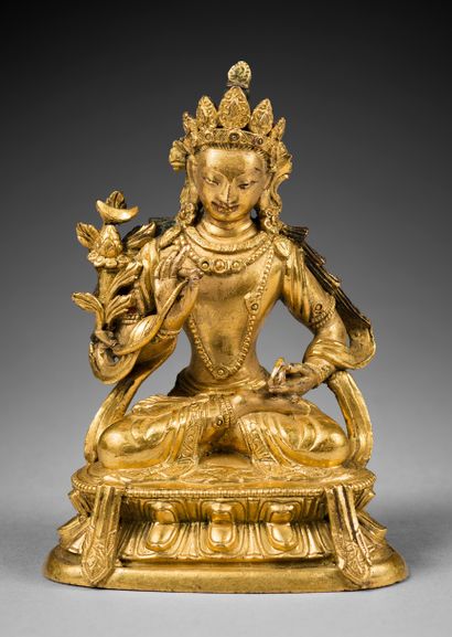 TRAVAIL SINO-TIBETAIN-XIXe siècle Gilded bronze statuette with traces of polychromy,...