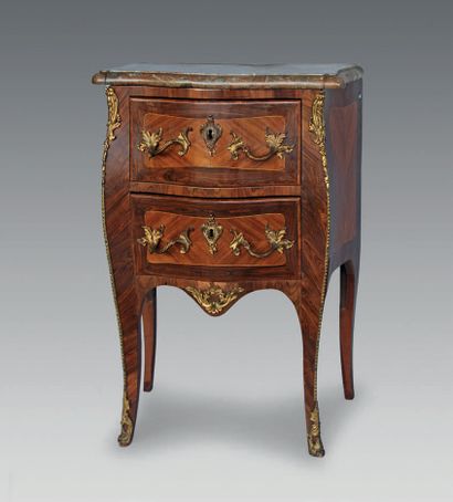 null A violet and rosewood chest of drawers opening to two drawers, the top of red...