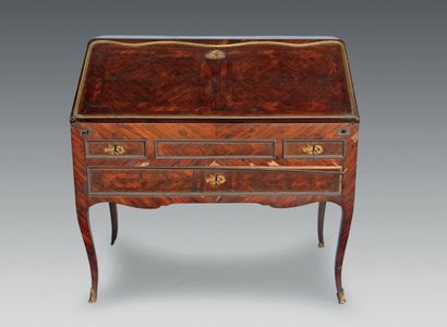 null A rosewood sloping desk, opening with three drawers and a flap revealing six...