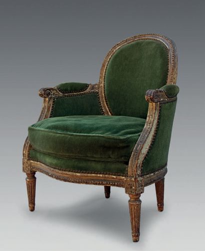null A moulded and carved beechwood armchair with a rounded cabriolet backrest, decorated...