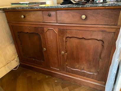 null Low sideboard in natural wood opening to three drawers in belt and two leaves....