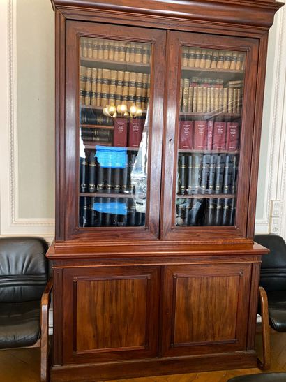 null Bookcase in rosewood veneer opening with two glass doors and two leaves. H....