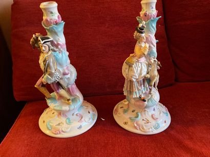 null Pair of candlesticks in polychrome porcelain on white background showing a couple...