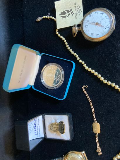 null Lot of costume jewelry including metal watch, pearl necklace.