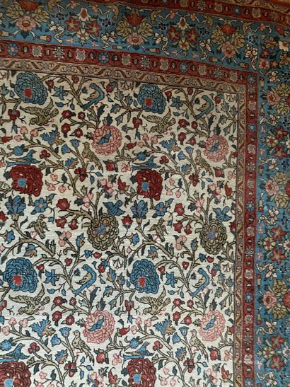null Oriental carpet with beige background decorated with flowering branches and...
