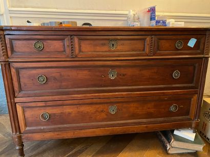 null Natural wood chest of drawers opening to three rows of drawers; front right...