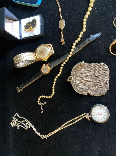 null Lot of costume jewelry including metal watch, pearl necklace.