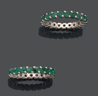null Two wedding rings in white gold 750 thousandths each one entirely set with emeralds...