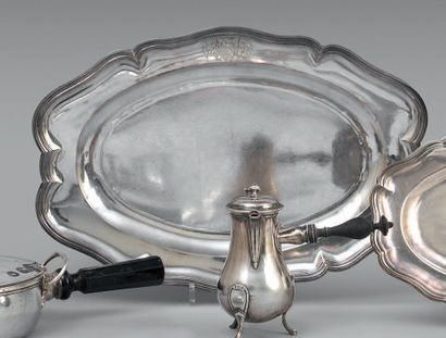 null Large plain silver dish of oval shape, the wing stamped with a coat of arms....