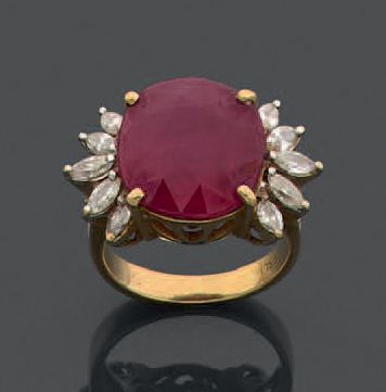 null Yellow gold ring 750 thousandths decorated in the center of a ruby treated between...