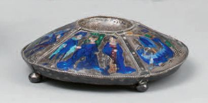 null * A round silver base (?) standing on four ball feet decorated with four engraved...