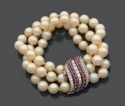 null Bracelet three rows of twenty cultured pearls each, the clasp in white gold...
