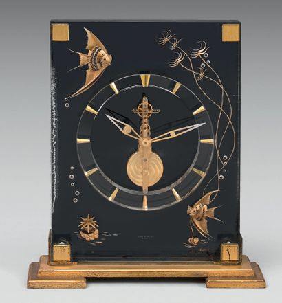 JAEGER LECOULTRE Plexiglass clock with "fish" motifs. Dial with rectilinear movement,...