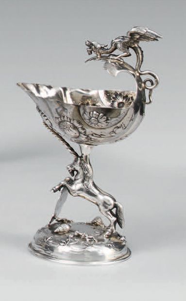 null Silver cup 800 thousandths posing on a round base with lacustrine decoration...