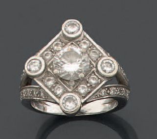 null Ring in white gold 750 thousandth, the center of diamond shape decorated with...