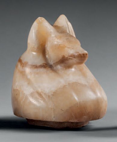 null Canopic vase stopper representing the jackal god
Douamoutef.
Alabaster. Repolishing...