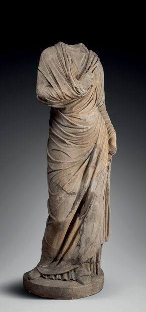null Headless statue representing a "togatus", the right arm folded on the chest.
Marble....