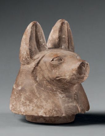 null Stopper of canopic vase representing the god with head of jackal Douamoutef.
Limestone....