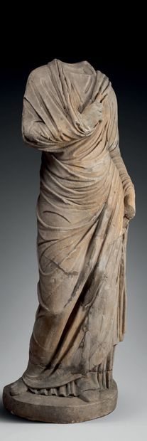 null Headless statue representing a "togatus", the right arm folded on the chest.
Marble....