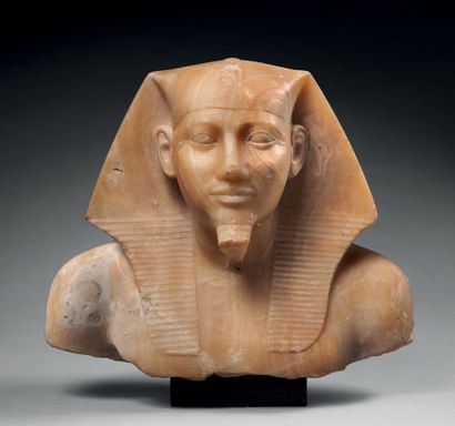 null Bust representing the portrait of a pharaoh wearing the nemes and the uraeus.
Alabaster....