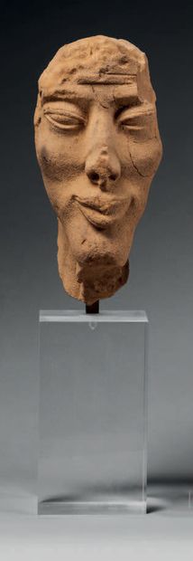 null Head representing a portrait of a man in the Amarna style.
Sandstone ?
H. 20.5...