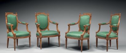 null Suite of four carved beechwood armchairs, with a back in the shape of a shield...