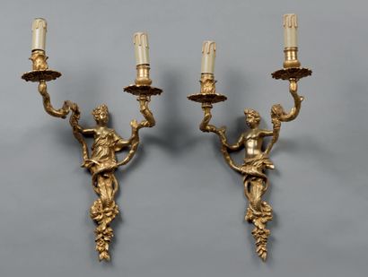 null Pair of ormolu sconces with figures of young boy and girl, with two arms of...