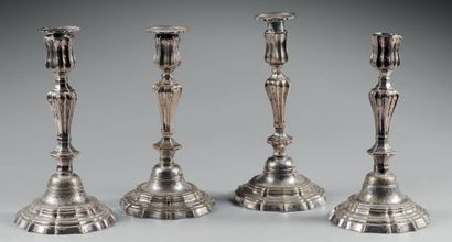null Two pairs of silver plated bronze torches (wear), the shaft in baluster and...