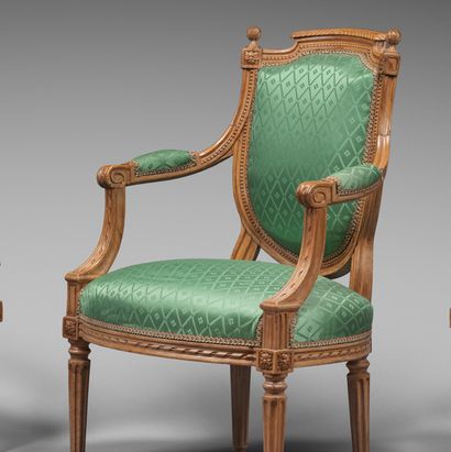null Suite of four carved beechwood armchairs, with a back in the shape of a shield...
