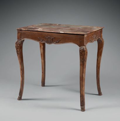 null Table with a red marble top from Flanders, resting on cambered legs decorated...