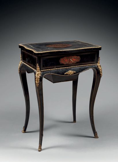 null Book table in blackened wood and marquetry of tortoiseshell and engraved brass,...
