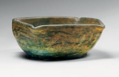 DAUM. Circular bowl with hot drawn tips. Industrial print made of green marbled glass...