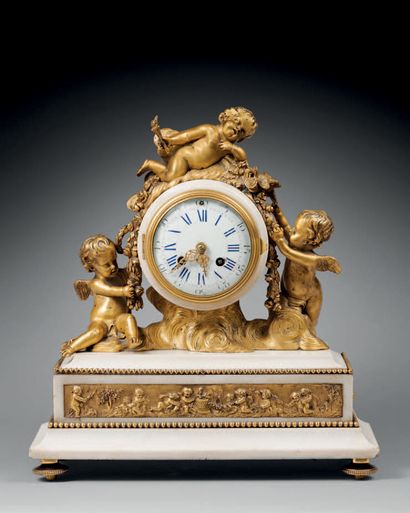 White marble and gilt bronze clock with a...