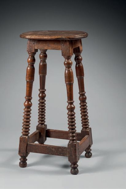 Stool of cantor in walnut resting on four...