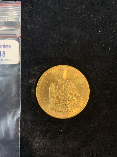 null Une pièce d'or de cinquante pesos (1947). 

(usures). 

Poids: 41.71 gr