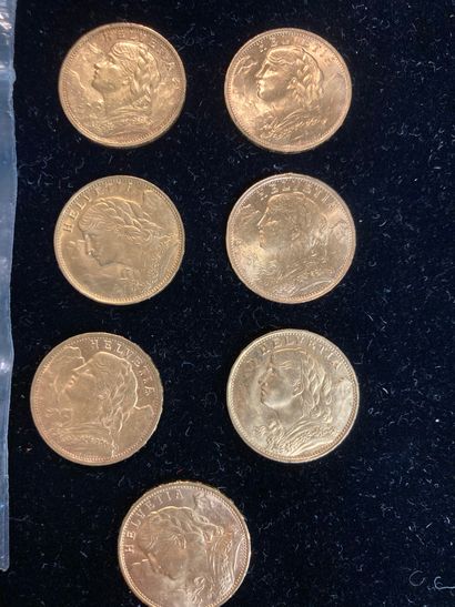 null Sept pièces d'or de vingt francs suisse (deux sont de frappes étrangères).

(usures)

Poids:...