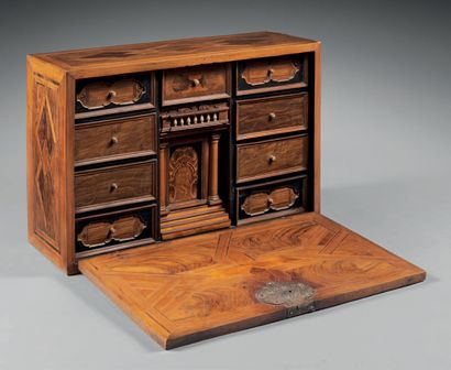 null Cabinet in walnut and fruitwood opening to a flap discovering twelve drawers,...