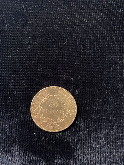 null Une pièce d'or de quarante francs (An12). 
Poids: 12.90 gr
(Usures)