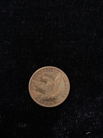 null Une pièce d'or de 10 dollars (1898). 
Poids : 16,64 gr.
(Usures)