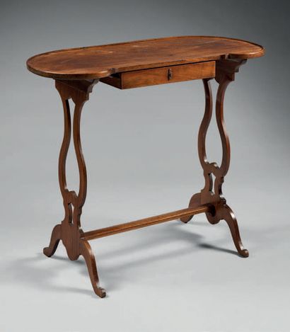 null Solid mahogany table with runners, the recessed top resting on openwork uprights.
First...