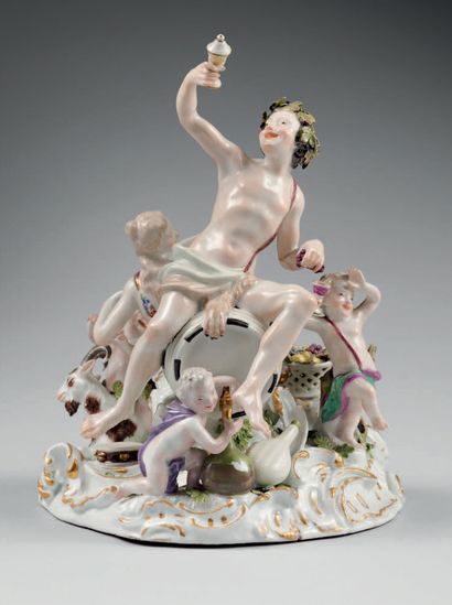 Meissen Porcelain group depicting Bacchus seated on a barrel accompanied by a woman...
