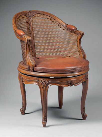 null Moulded and carved wood caned desk armchair with swivel seat, gondola-shaped...