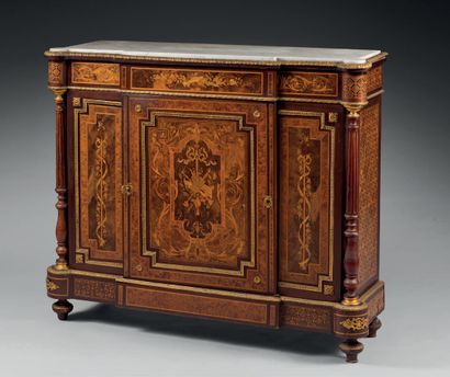 null A marquetry sideboard, the projecting front opening to a leaf, decorated with...