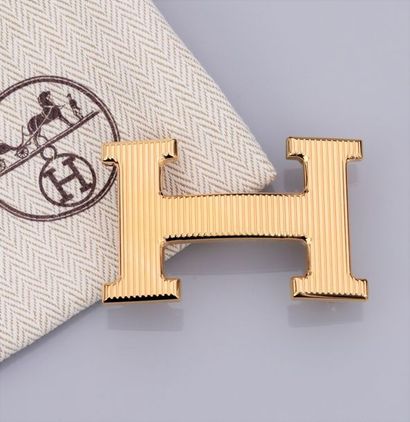 HERMES HERMES, boucle de ceinture Constance calandre dorée. Signée et numérotée....