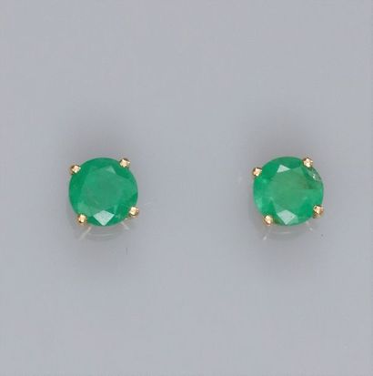   Pair of 750°/00 (18K) yellow gold chips, each set with a round emerald of approximately...