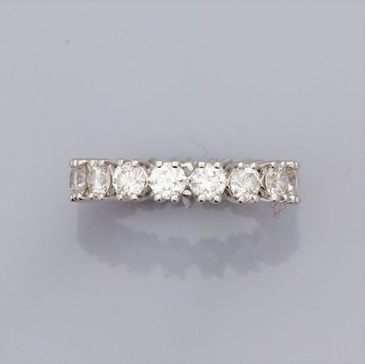   Wedding band in 750°/00 (18K) white gold, set with brilliant-cut diamonds on the...