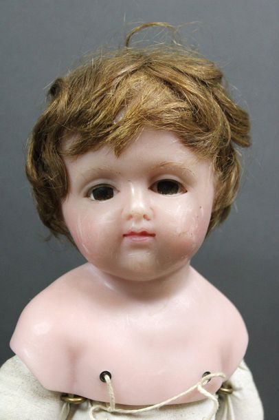 null English doll, head, arms and legs in wax, body in fabric with zipper system...