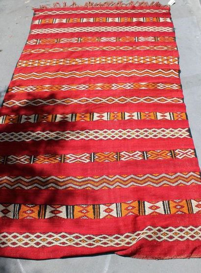null Kilim carpet decorated with geometric friezes on a red background, 2m75 X 1m60,...