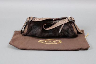 null TOD's

Small brown rabbit and snake leather bag with its cover