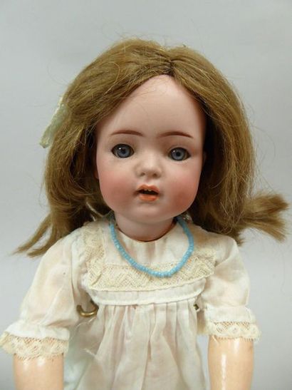 null German doll, porcelain head marked in hollow: KR and Simon & Halbig 121, blue...